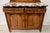 Art Deco period buffett in solid walnut Two rounded uprights carved with floral decoration Two doors and two drawers...