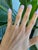 A natural color-change alexandrite glows at the centre of this solid 14K yellow gold ring, framed by fourteen earth-mined...