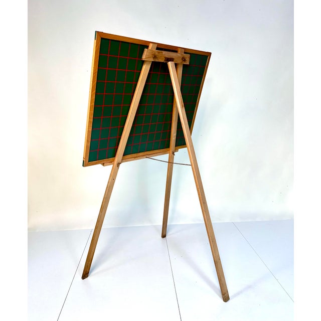 Original school blackboard with wooden three-legged stand, manufactured in Germany during 1950s. An authentic and...