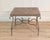 A distinctive French coffee table from the 1980s featuring a decorative parquet top arranged in an “Old Wind Rose”...