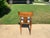 Modern mid century style dining chair, in the Manner of Robsjohn Gibbings. The chair has a newly upholstered cushion that...