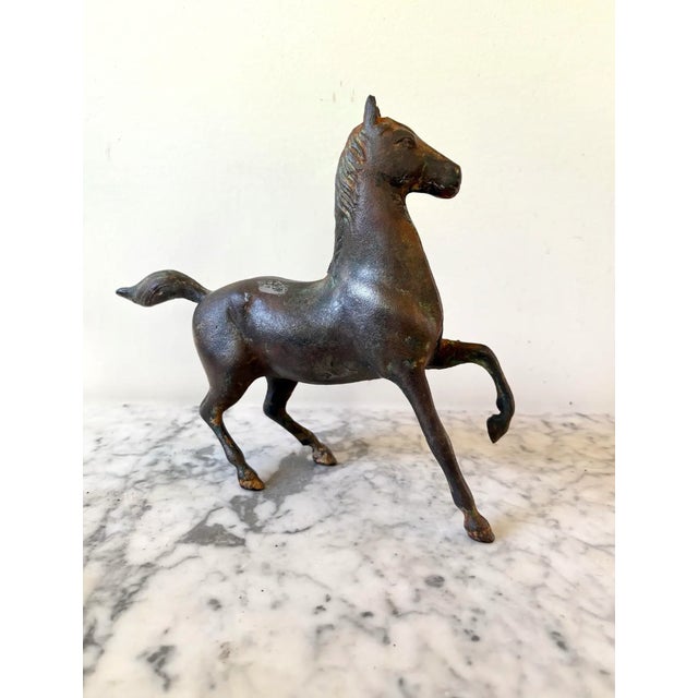Wonderful bronze sculpture of a trotting horse. Deep patina.