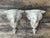 This striking pair of vintage wall brackets features intricately carved elephant motifs, offering a captivating blend of...