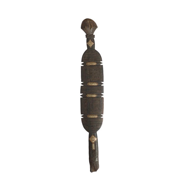This striking 80 cm vintage Berber hand-carved wooden tent peg is a rare ethnographic object originating from North...