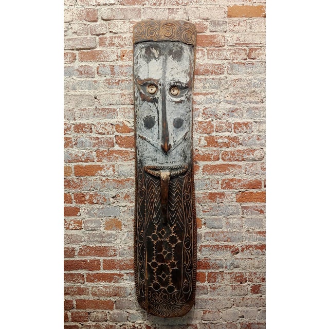 19th century Antique Oceanic Tribal Mask w/Long Nose & Tongue Dimension: 56 inches high 13 inches wide; 4 1/2 inches deep;...