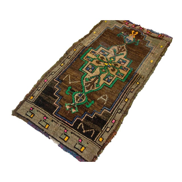 Vintage Handknotted decorative mini rug from Kars region of Turkey. Approximately 45-55 years old. In very good condition.