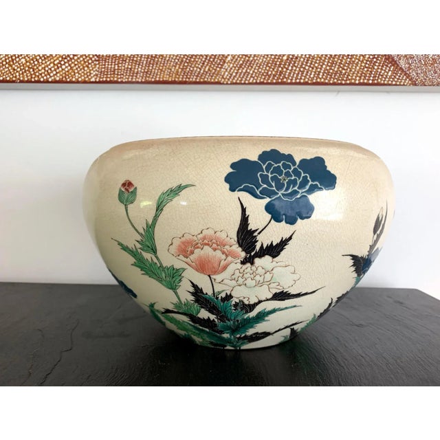 A beautifully crafted large ceramic bowl as a centerpiece by Okumura Shozan (1842-1905) in the Kyo-yaki (kyoto ware)...