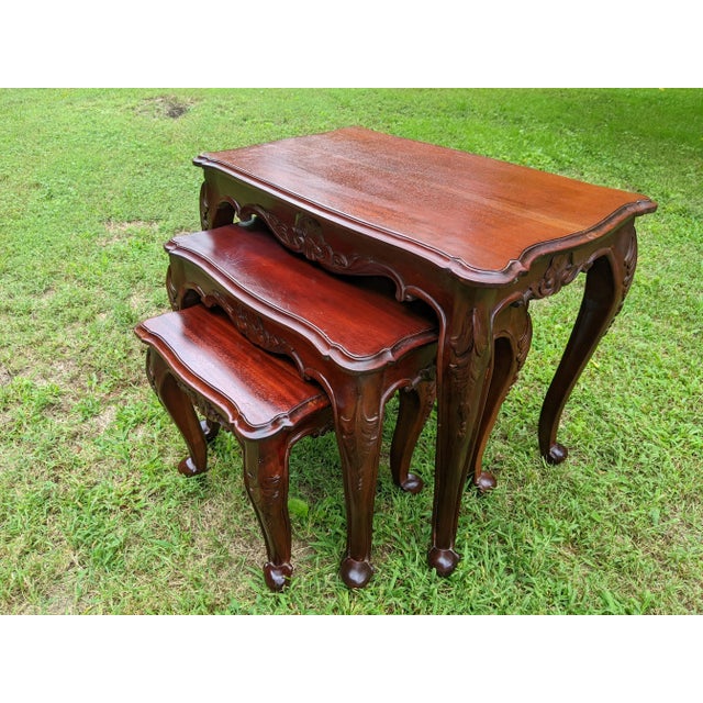 I'm very pleased to offer for sale this exceptional set of three (3) Queen Anne-style, solid cherry wood nesting tables...