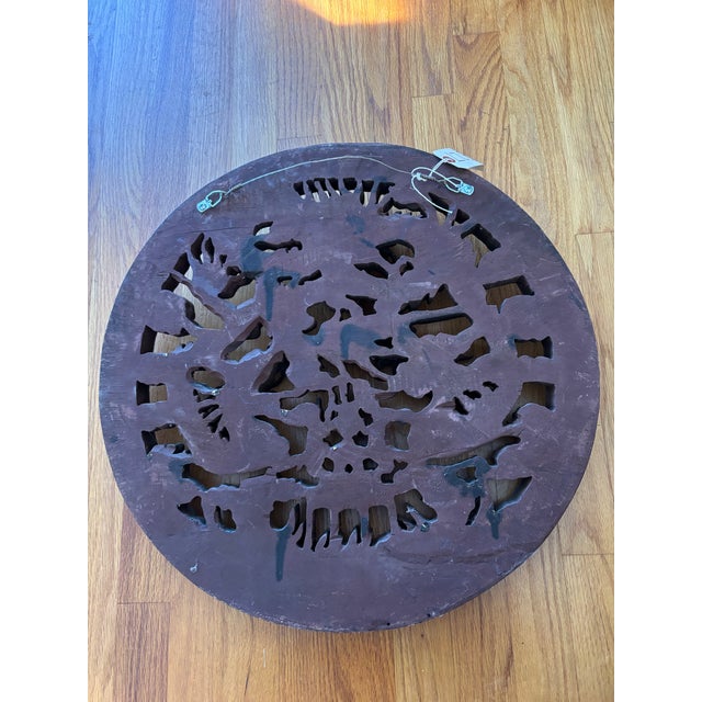 An exceptional Qing Dynasty circular architectural panel meticulously hand-carved with dynamic openwork and deep high-...