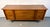 A beautifully crafted mid-century modern walnut sideboard by Bassett Furniture Inc. of Indiana. Featuring clean lines,...
