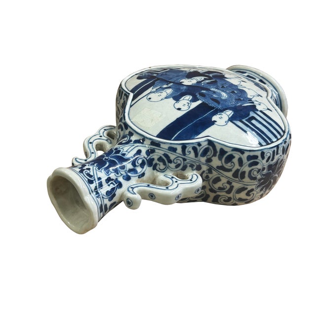 Elevate your collection or interior space with this exquisite antique Chinese blue and white porcelain garlic-mouth vase...