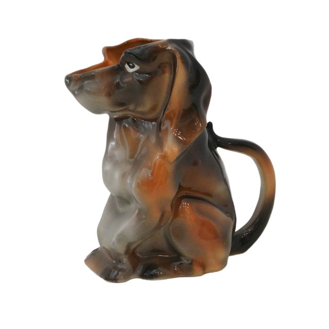 Add a touch of whimsical Bavarian elegance to your table with this rare, antique figural Dachshund creamer from Royal...