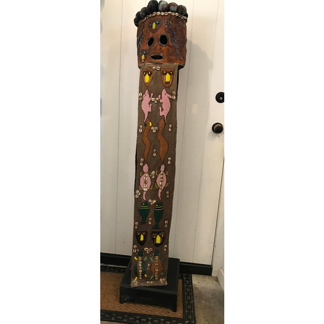 Beaded African ceremonial mask with museum display stand. Thought to be Nigerian, purchased under the supervision of a...