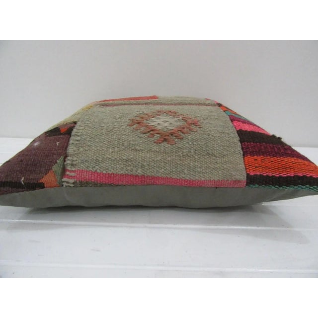 This is a pillow cover made from a vintage kilim rug. The piece was properly washed and ready to use. Pillow inserts not...