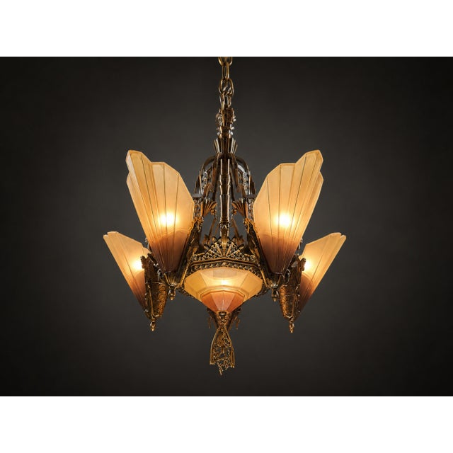 A striking example of American Art Deco lighting, this authentic Mid West Manufacturing Soleure Series 6-light chandelier...