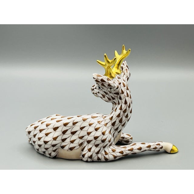 Celebrate the exceptional artistry of Hungarian porcelain with this exquisite **Herend Roe Buck Deer Figurine in the...