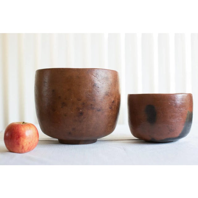 (2) Rinjan Lombok Indonesia Clay Pottery Bowls in a rich warm brown color with dark brown/blackish burnishing in...