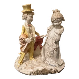 Mid Century Polychrome Chalkware Figurine of Romantic Couple in 18th Century Attire For Sale