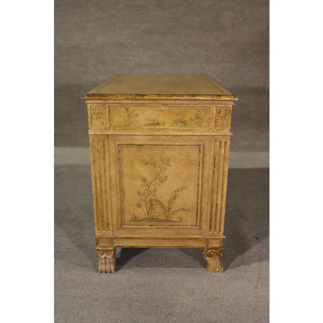 Vintage two door buffet cabinet with top drawer. Features an aged look with painted front and sides, as well as claw feet....