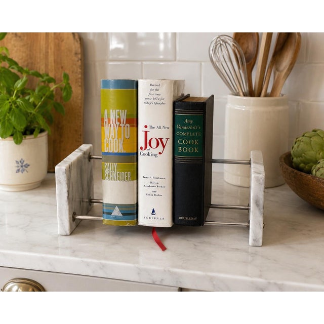 A refined vintage modernist cookbook rack crafted from solid white marble and chrome-tone metal rods. Minimalist yet...