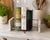 A refined vintage modernist cookbook rack crafted from solid white marble and chrome-tone metal rods. Minimalist yet...