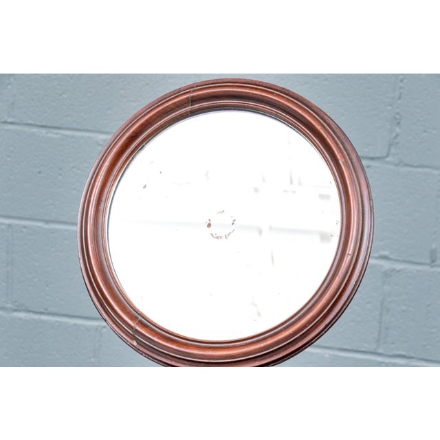 A circa 1870 Victorian style mahogany shaving stand or gentleman's dressing mirror with a round tilting mirror in a molded...