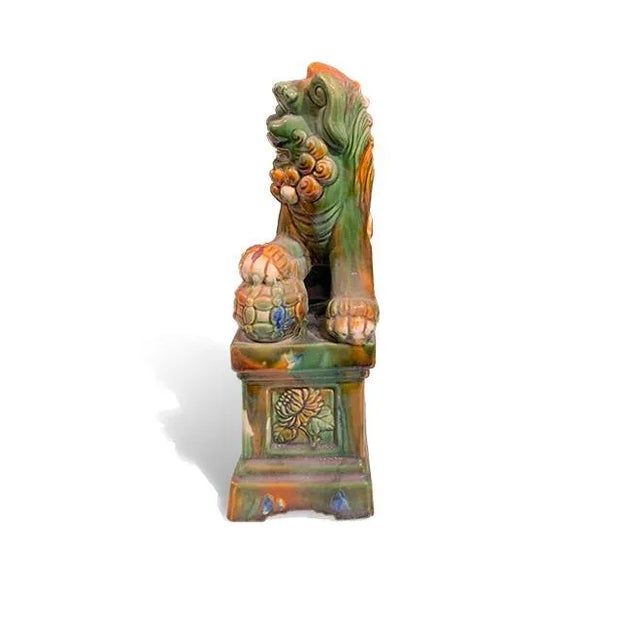 Tang Dynasty Color Male Fu Dog is made out of ceramic. It protect you and push away from evils. It is good accent piece...
