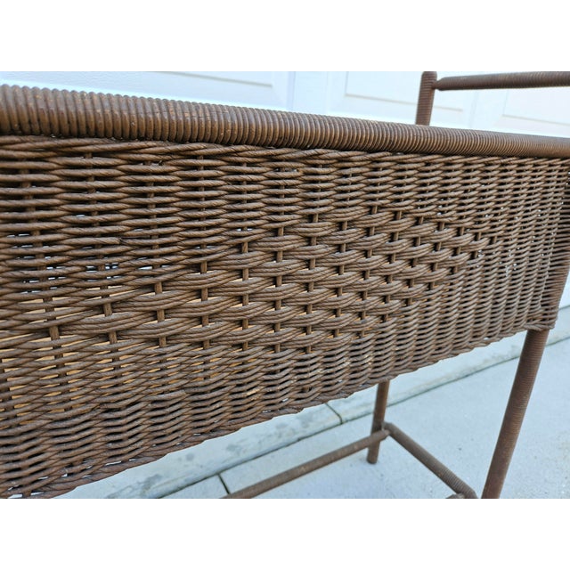 A classic open wooden and wicker window box planter with spindle legs. The interior dimensions of the box are 26.5 inches...