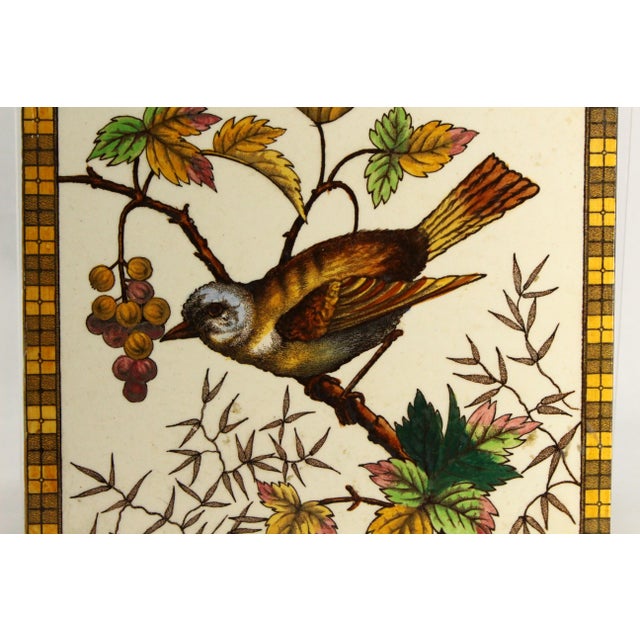 A great looking antique ceramic tile in Art Nouveau / Arts & Craft style Beautiful hand tinted transfer design with song...