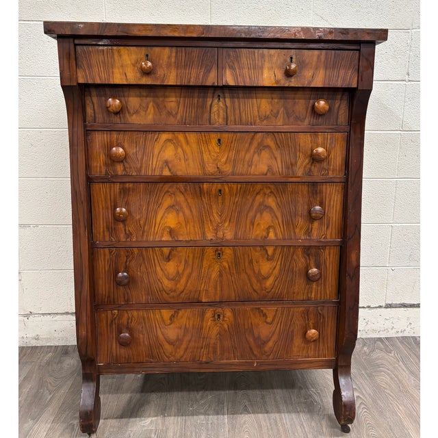 This is a stunning antique American Empire Biedermeier-influenced walnut veneer chest of drawers, bureau, or dresser with...