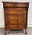 This is a stunning antique American Empire Biedermeier-influenced walnut veneer chest of drawers, bureau, or dresser with...