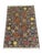 A gray field showcases eight richly colored Philpa motifs in burgundy, cream, gold, and soft green. Bold patterned borders...