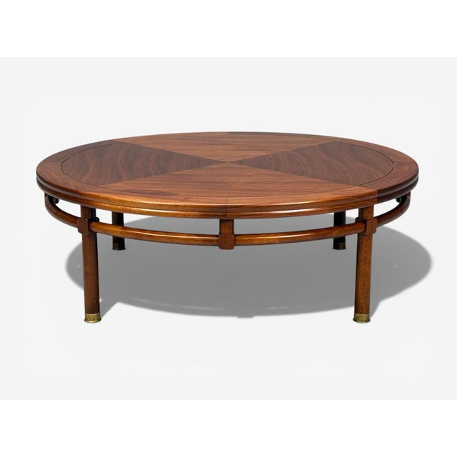 T.H. Robsjohn-Gibbings, American Mid-Century Modern, Round Coffee Table, Brass, Walnut, USA, 1960s A round fully...