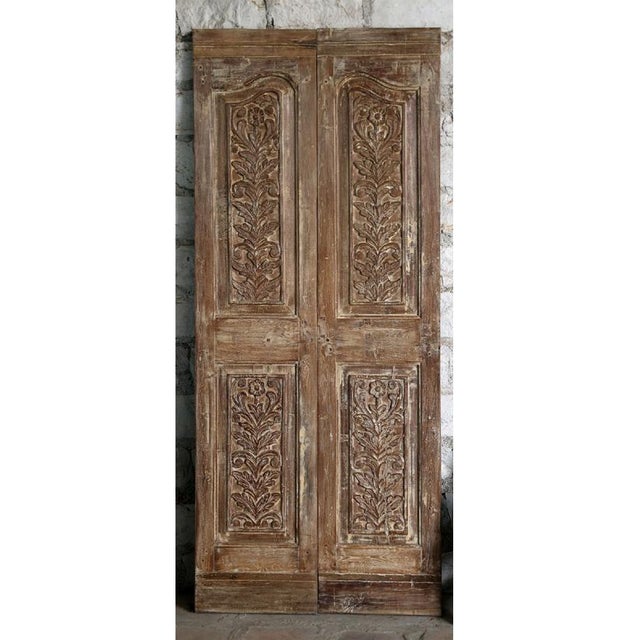 This stunning pair of antique pantry doors showcases exquisite hand-carved floral detailing, reflecting the artistry and...