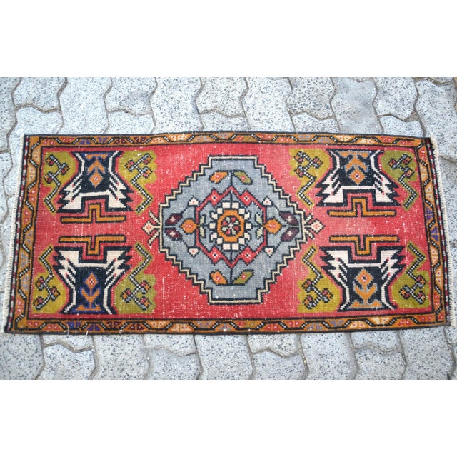 This is a vintage Turkish Oushak rug from the 1960s. The piece was hand-knotted.