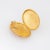 Elegant and finely detailed vintage Art Deco era locket (circa 1918) crafted in 9k yellow gold. The oval shaped locket...
