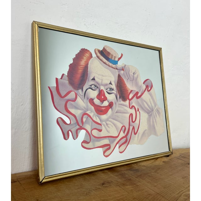 Vintage Elmo the Clown mirror created by the American artist Arthur Sarnoff. This image shows a cheerful whiteface clown...