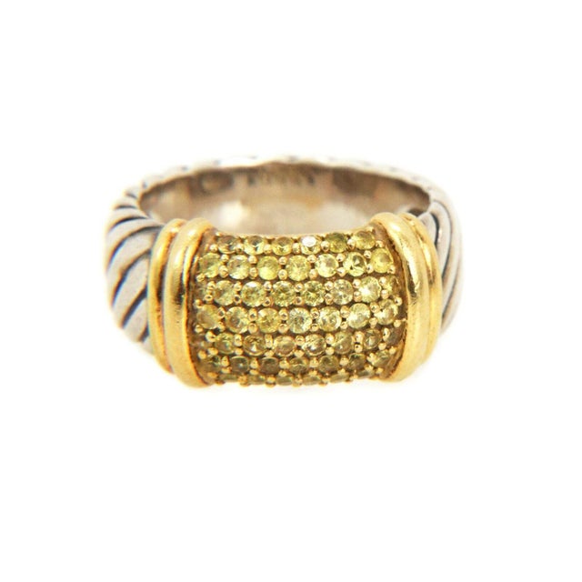 This cable band ring is authentic from David Yurman, crafted from sterling silver with 18k yellow gold accent featurig an...