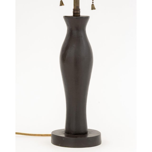 Giacometti Style Patinated Bronze Table Lamp, with two bulb fittings and black shade. 20.5" H x 12" Diameter. Provenance:...