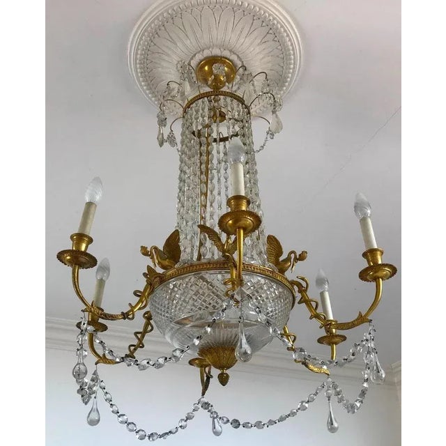 Finely chiseled gilt bronze and cut crystal Empire elegant chandelier with six arms. Six E14 light bulbs. Up to 250V...