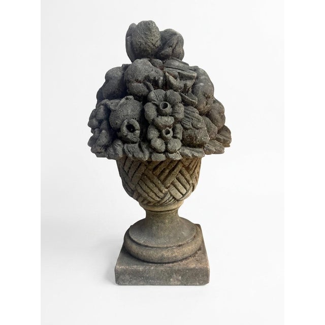 Elevate your outdoor or architectural spaces with this classical cast stone garden ornament, designed as an overflowing...