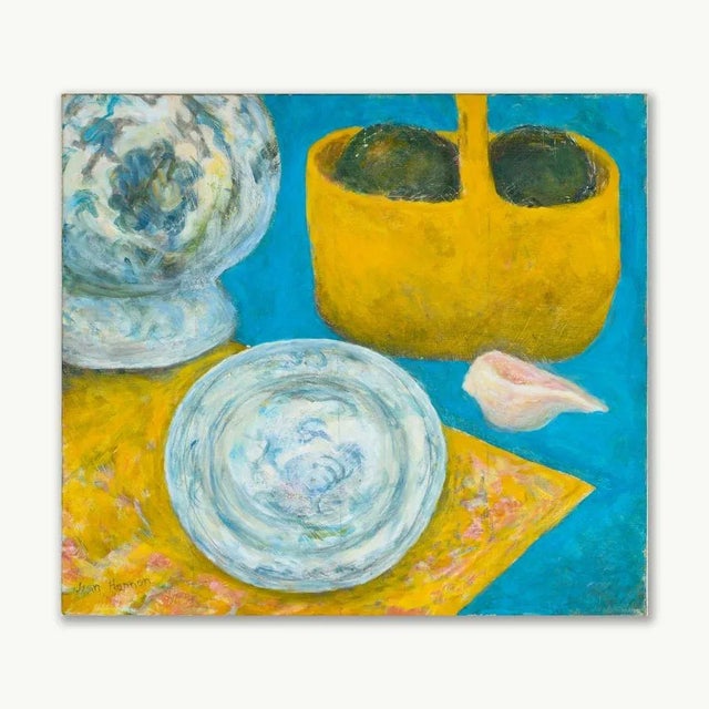 Still Life depicting blue and white porcelain with seashell and basket. Signed by the artist. Jean Hannon grew up in...