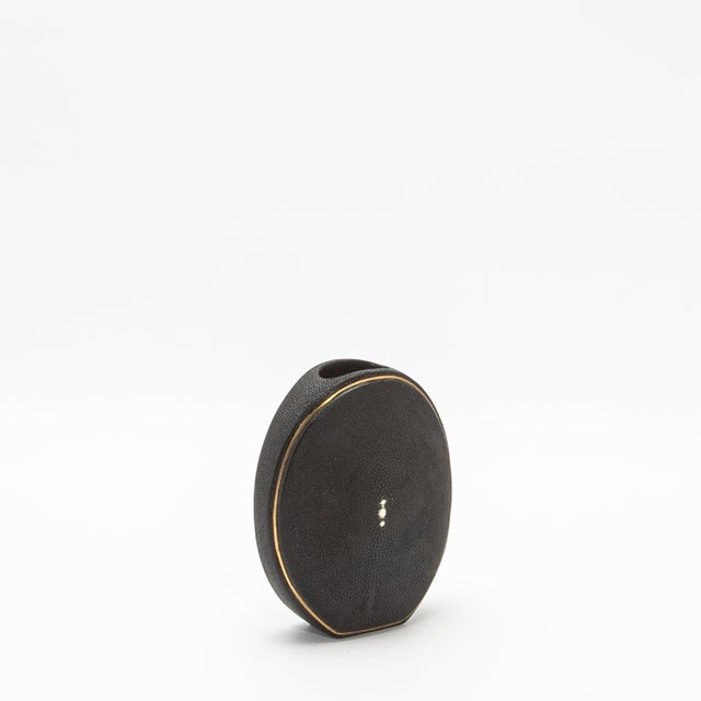 The elegant "Oval Vase" by R&Y Augousti, crafted in shagreen and accented with brass, is a sophisticated fusion of organic...