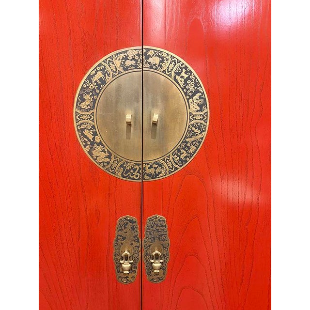 Red Lacquer Armoire is make out of elm wood. It has 4 Drawers and 2 doors, and 1 removable shelf and rod. At the bottom of...