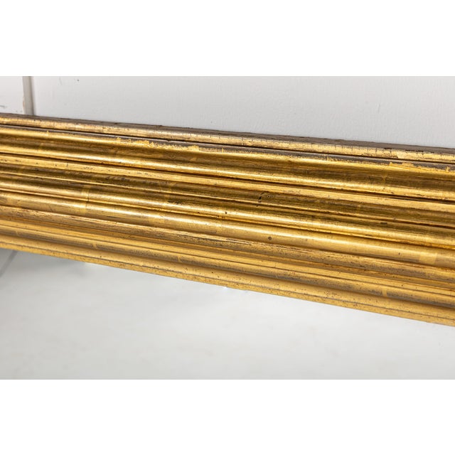 Large Scale 19th Century English Regency Giltwood Overmantel Mirror. This mirror is a lovely example of a regency...