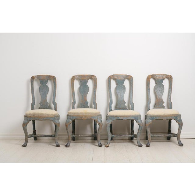 Antique Swedish chairs from the late Baroque period, around 1770. This is a set of four chairs which are an original set...
