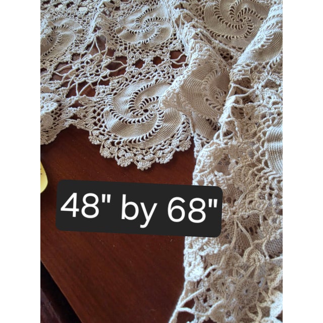 Beautiful traditional vintage crochet tablecloth with a swirl pattern.