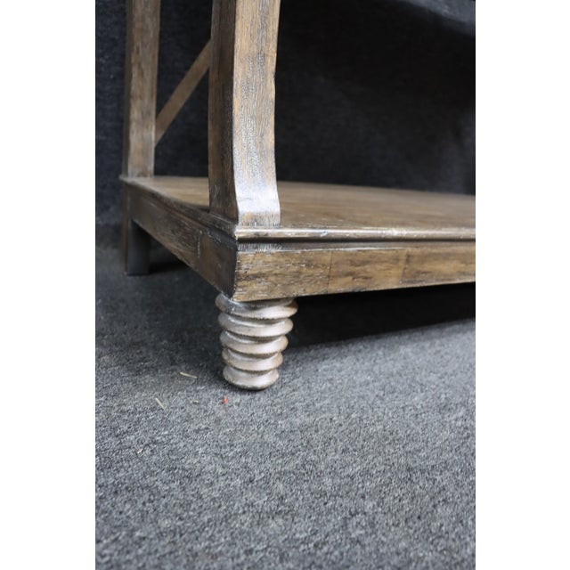 Country French style open shelving unit crafted in oak with a naturally worn, distressed finish. The frame features gently...