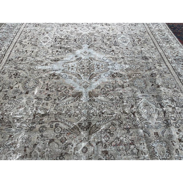 This Antique Distressed Mahal is an all wool Handmade and Hand knotted rug. It has an all over design from the 20th...