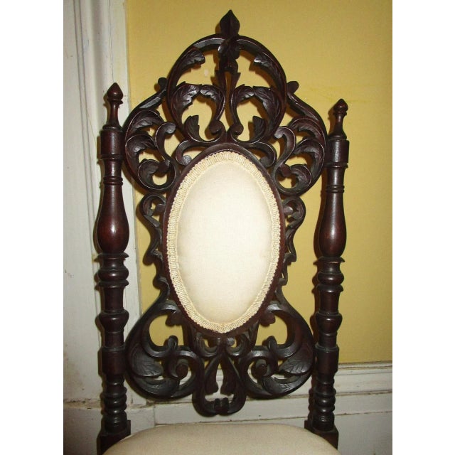 It is very unusual to find such a fine example of American Rococo Revival tracery carving in a child's chair, but this...